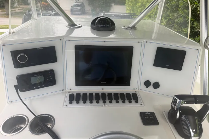 Slide: The Image of Control panel of a 2000 Ocean Runner 27 boat with navigation and communication equipment. - 20