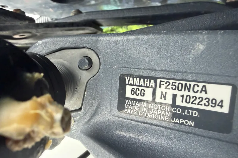 Slide: The Image of Yamaha F250NCA engine label on a 2000 Ocean Runner 27 boat. - 27
