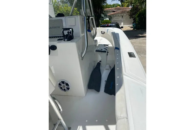 Slide: The Image of 2000 Ocean Runner 27 boat interior with Garmin equipment and diving fins. - 5
