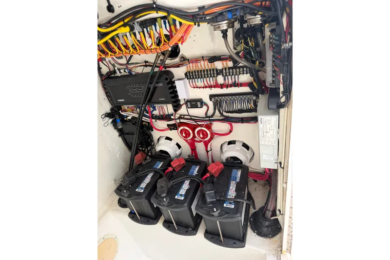 Slide: The Image of Electrical system of a 2000 Ocean Runner 27 boat, featuring batteries and wiring. - 38