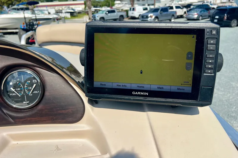 Slide: The Image of Garmin GPS and fuel gauge on 2017 Forest River 222 boat dashboard. - 16