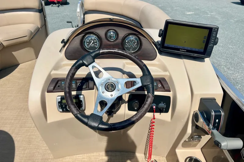 Slide: The Image of Steering console of 2017 Forest River 222 boat with GPS and gauges. - 15
