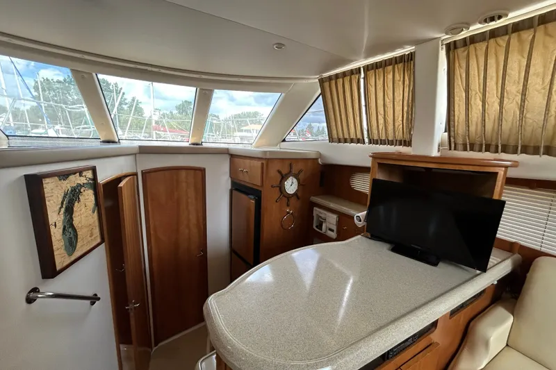 Slide: The Image of Interior of 2002 Carver 366 Motor Yacht with wood cabinetry and modern amenities. - 42