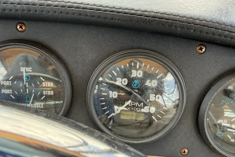 Slide: The Image of Dashboard of a 2002 Carver 366 Motor Yacht showing RPM and sync gauges. - 18