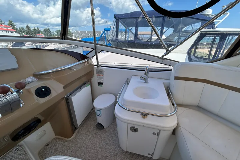 Slide: The Image of Interior of 2002 Carver 366 Motor Yacht with sink and seating area. - 17