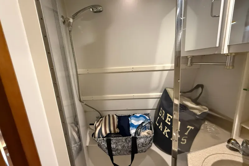 Slide: The Image of Shower area in 2002 Carver 366 Motor Yacht with storage bags and modern fixtures. - 22