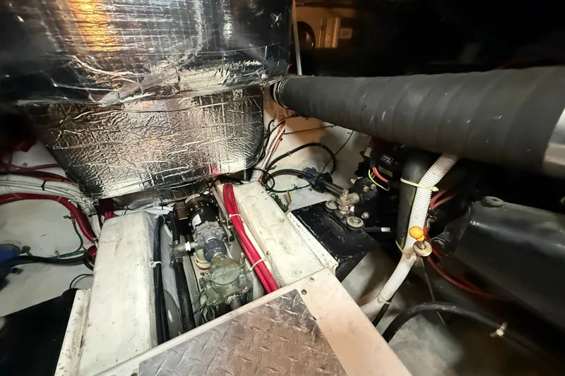 Slide: The Image of Engine room of a 2002 Carver 366 Motor Yacht, showcasing mechanical components and wiring. - 45