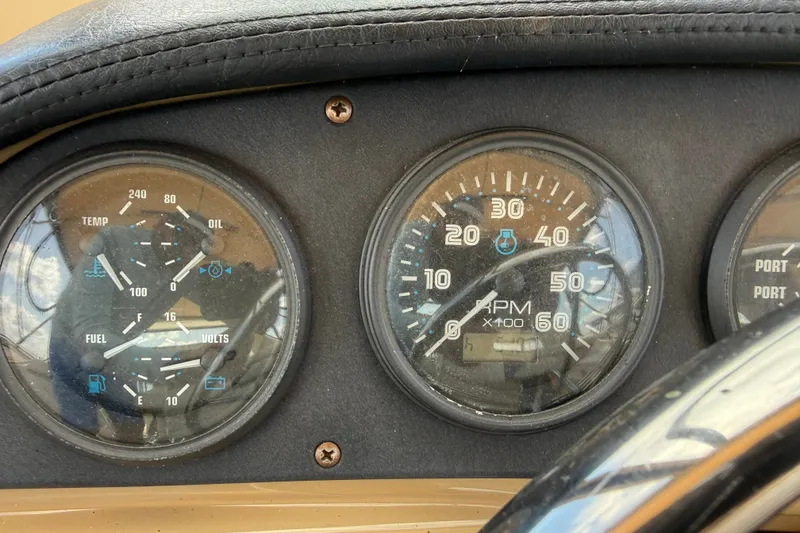 Slide: The Image of Close-up of 2002 Carver 366 Motor Yacht dashboard gauges, showing RPM, temperature, and fuel indicators. - 19