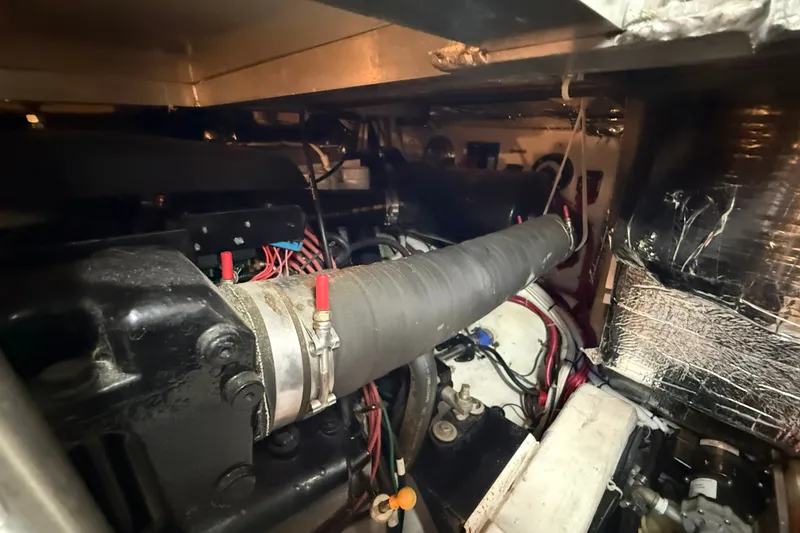 Slide: The Image of Engine room of a 2002 Carver 366 Motor Yacht with visible components and wiring. - 44