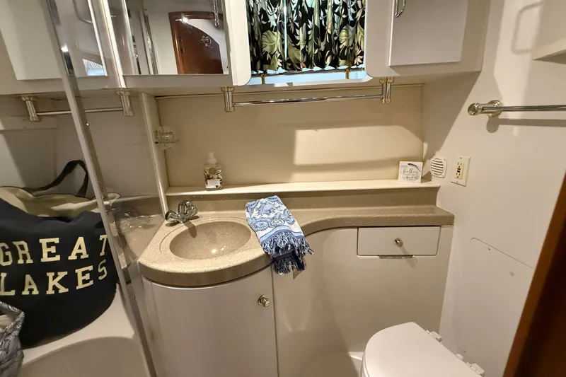 Slide: The Image of Bathroom interior of 2002 Carver 366 Motor Yacht with sink, towel, and storage. - 23