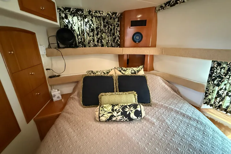 Slide: The Image of Luxurious 2002 Carver 366 Motor Yacht bedroom with elegant bedding and floral curtains. - 24