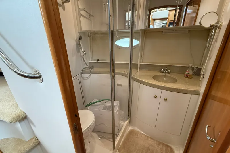 Slide: The Image of Luxurious bathroom in 2002 Carver 366 Motor Yacht with shower, sink, and toilet. - 27
