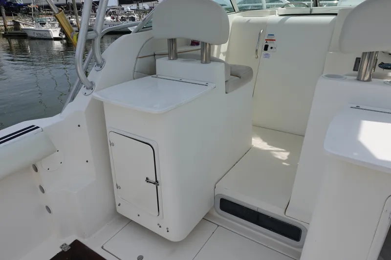 Slide: The Image of 2004 Grady-White Tournament 275 boat interior with seating and storage compartments. - 9