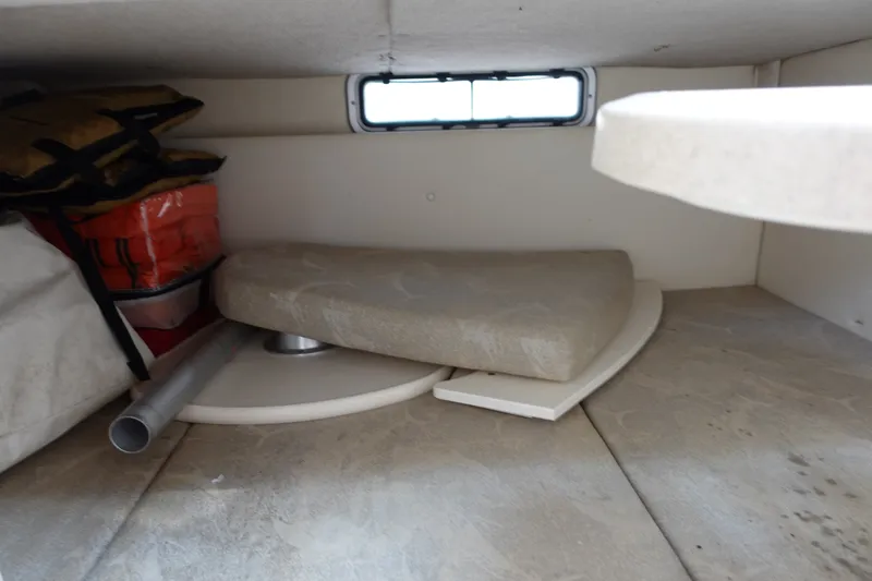 Slide: The Image of Interior storage of 2004 Grady-White Tournament 275 boat with life jackets and cushions. - 20