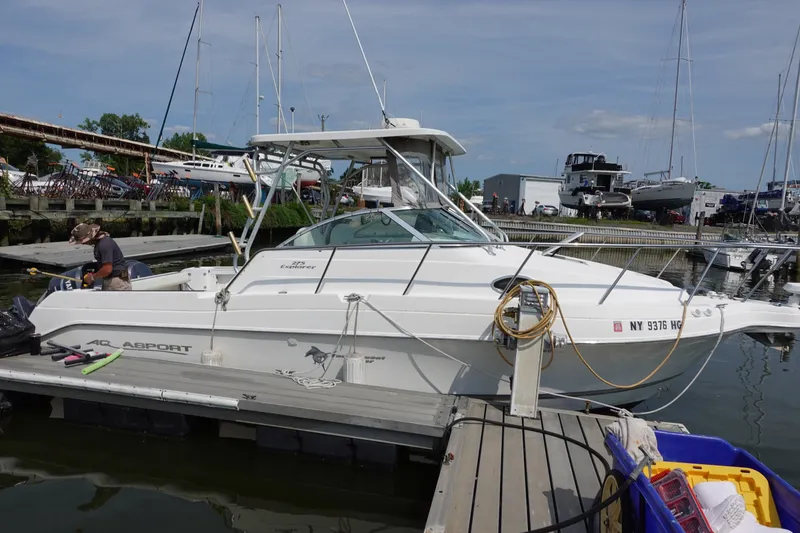 The Image of 2004 Grady-White Tournament 275 boat docked at marina, side view. - 0