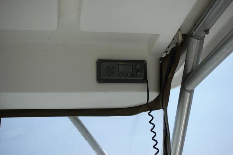 Slide: The Image of 2004 Grady-White Tournament 275 boat interior with mounted radio system. - 15