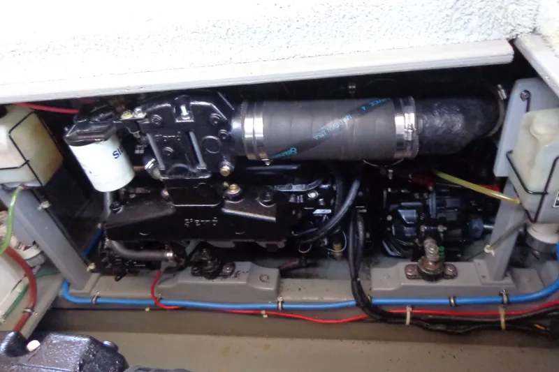 Slide: The Image of Engine compartment of a 1989 Tollycraft 34 Sport Sedan boat, showing mechanical components. - 40