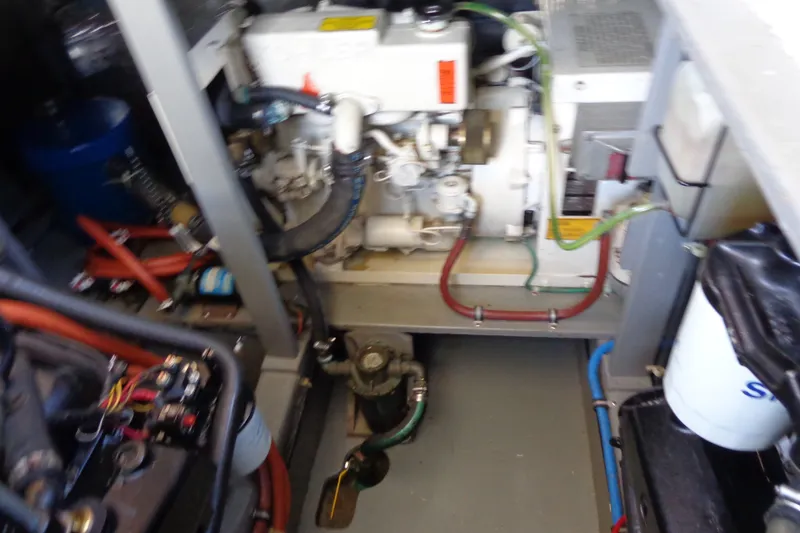 Slide: The Image of Engine room of 1989 Tollycraft 34 Sport Sedan with visible machinery and wiring. - 39