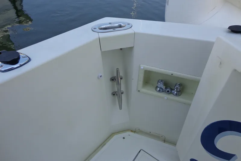 Slide: The Image of 1989 Tollycraft 34 Sport Sedan boat deck corner with cleat and fittings. - 43