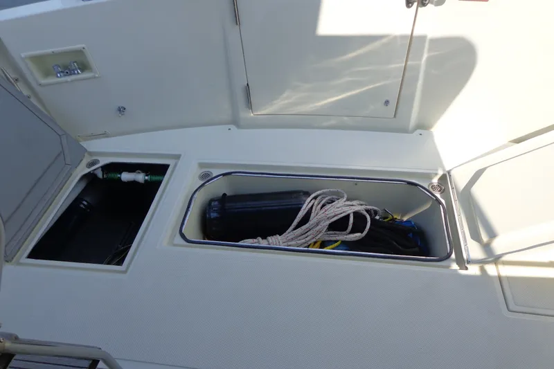 Slide: The Image of Storage compartments on a 1989 Tollycraft 34 Sport Sedan boat deck. - 56
