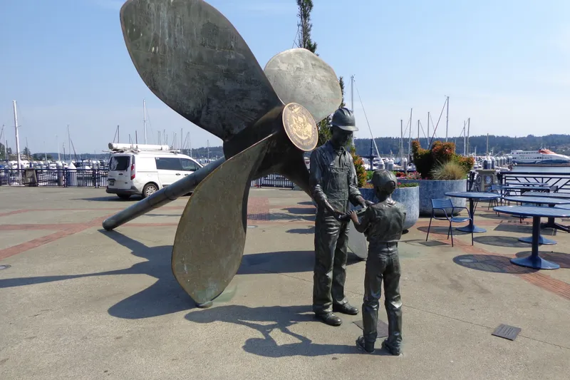 Slide: The Image of Meet Captain Robert Heay right here at this bronze statue and we'll head down to the Tolly. - 64