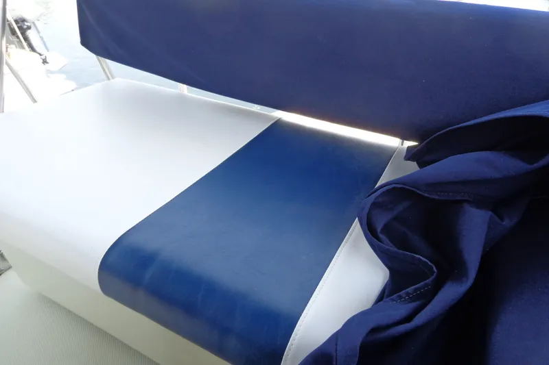 Slide: The Image of Blue and white seating on a 1989 Tollycraft 34 Sport Sedan boat. - 54