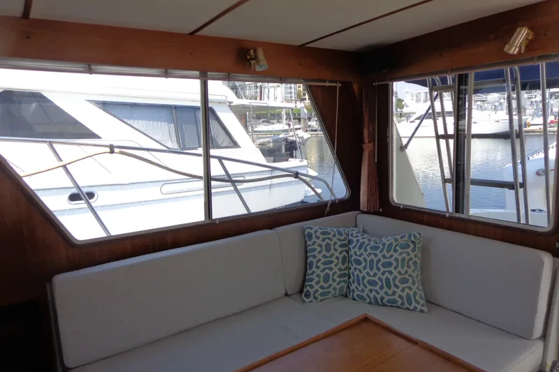Slide: The Image of Interior view of 1989 Tollycraft 34 Sport Sedan with marina backdrop. - 15