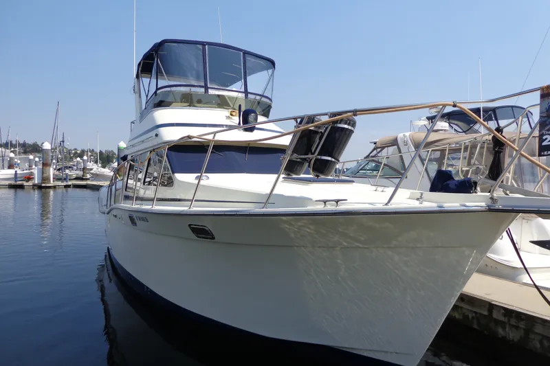 Slide: The Image of 1989 Tollycraft 34 Sport Sedan yacht docked at marina under clear sky. - 60