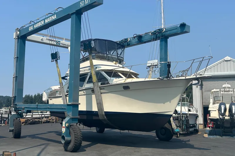 Slide: The Image of 1989 Tollycraft 34 Sport Sedan on a lift at Gig Harbor Marina. Photo taken 8-15 when boat was hauled for fresh bottom paint and new electric trim tabs. - 63
