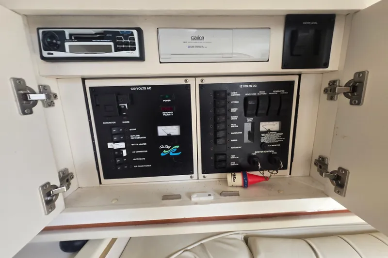 Slide: The Image of Electrical control panel of 2000 Sea Ray 290 Amberjack boat with stereo system. - 21
