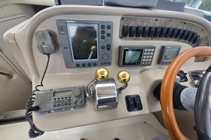 Slide: The Image of Control panel of a 2000 Sea Ray 290 Amberjack boat with navigation equipment. - 4