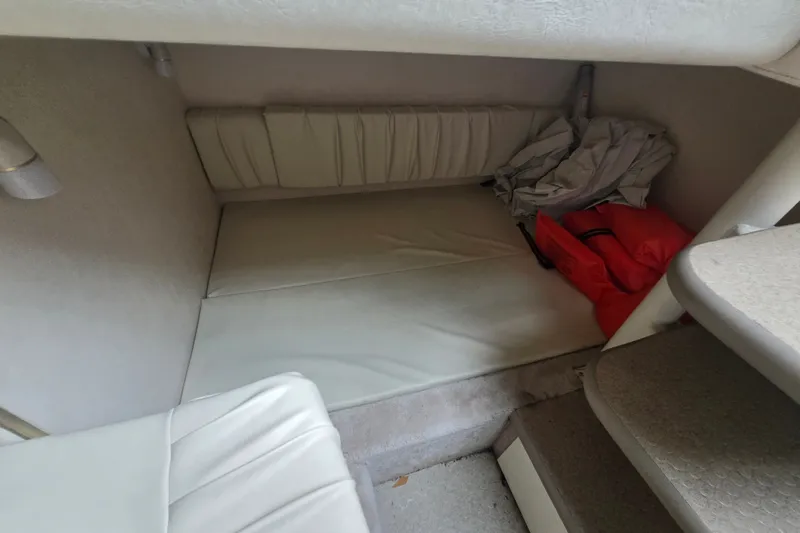 Slide: The Image of Interior cabin of 2000 Sea Ray 290 Amberjack with seating and storage. - 16