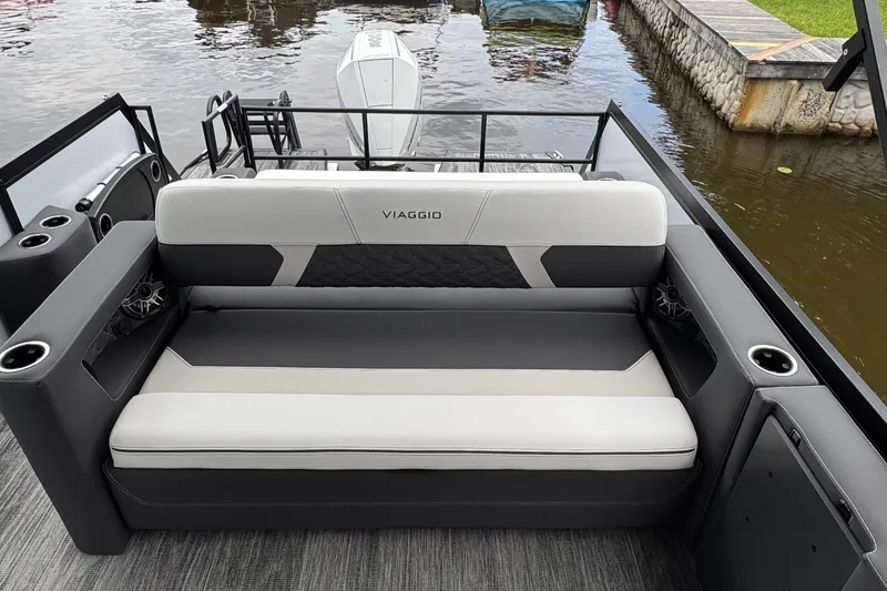 Slide: The Image of Luxurious seating on 2026 Viaggio Diamante S 26 boat, featuring sleek design and cup holders. - 19