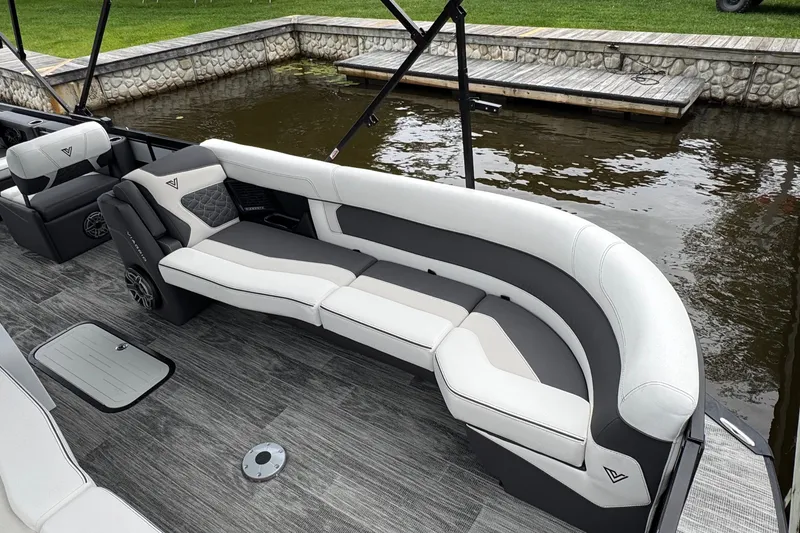 Slide: The Image of Luxurious seating on the 2026 Viaggio Diamante S 26 pontoon boat by the water. - 7