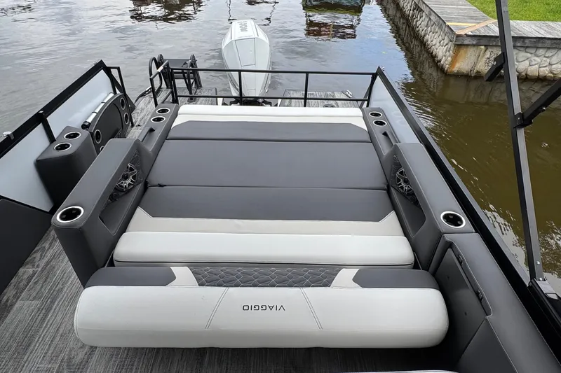 Slide: The Image of Luxurious 2026 Viaggio Diamante S 26 boat interior with plush seating and cup holders. - 21