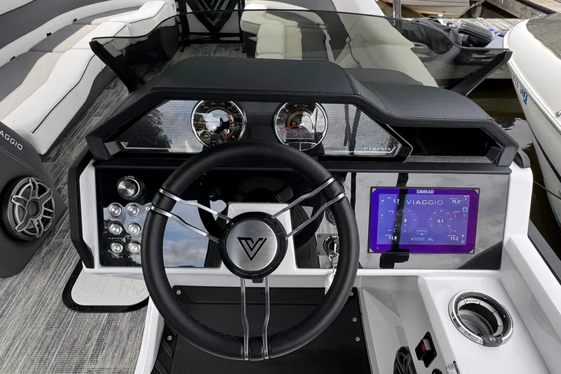 Slide: The Image of Steering console of 2026 Viaggio Diamante S 26 boat with modern controls and display. - 15