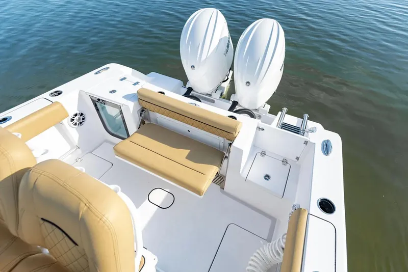 Slide: The Image of Manufacturer Provided Image: 2025 Sportsman Open 252 Center Console boat with dual engines and tan seating. - 11