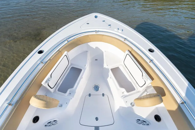Slide: The Image of Manufacturer Provided Image: 2025 Sportsman Open 252 Center Console boat with open storage compartments. - 2