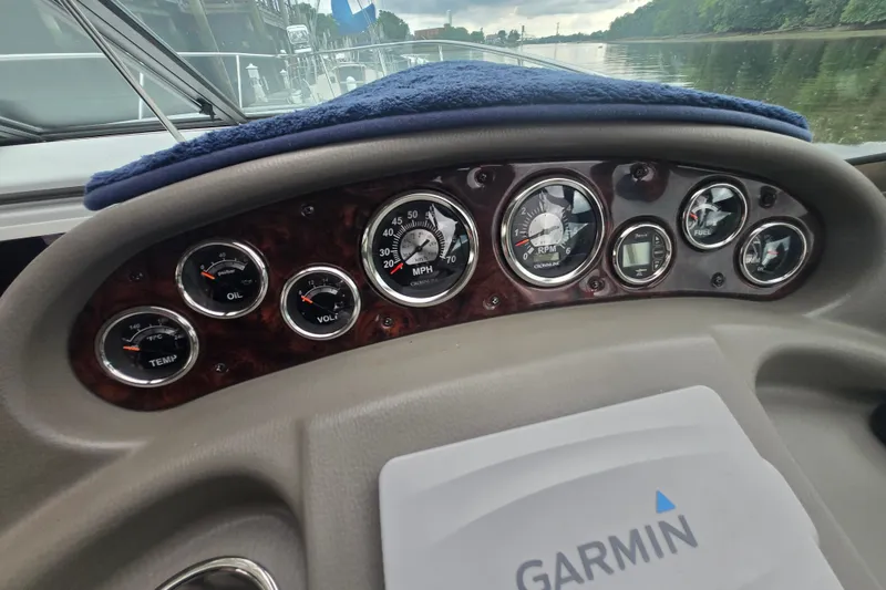 Slide: The Image of Dashboard of a 2014 Crownline 264 CR boat with Garmin navigation system. - 16