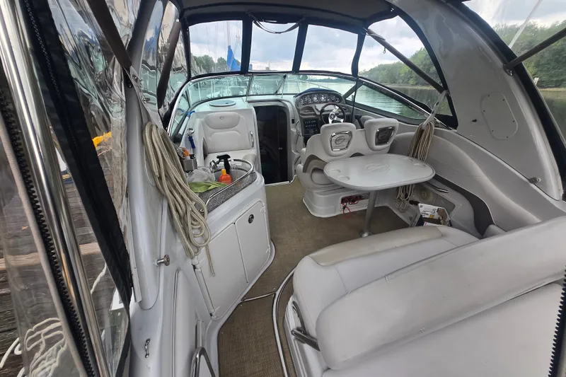 Slide: The Image of Interior of a 2014 Crownline 264 CR boat with seating and helm. - 4