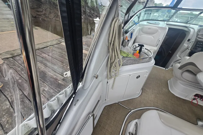 Slide: The Image of Interior of a 2014 Crownline 264 CR boat with seating and sink area. - 10
