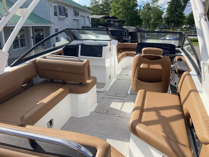 Slide: The Image of The image shows the interior of a Cobalt R26 boat with brown leather seats and a modern design. - 12