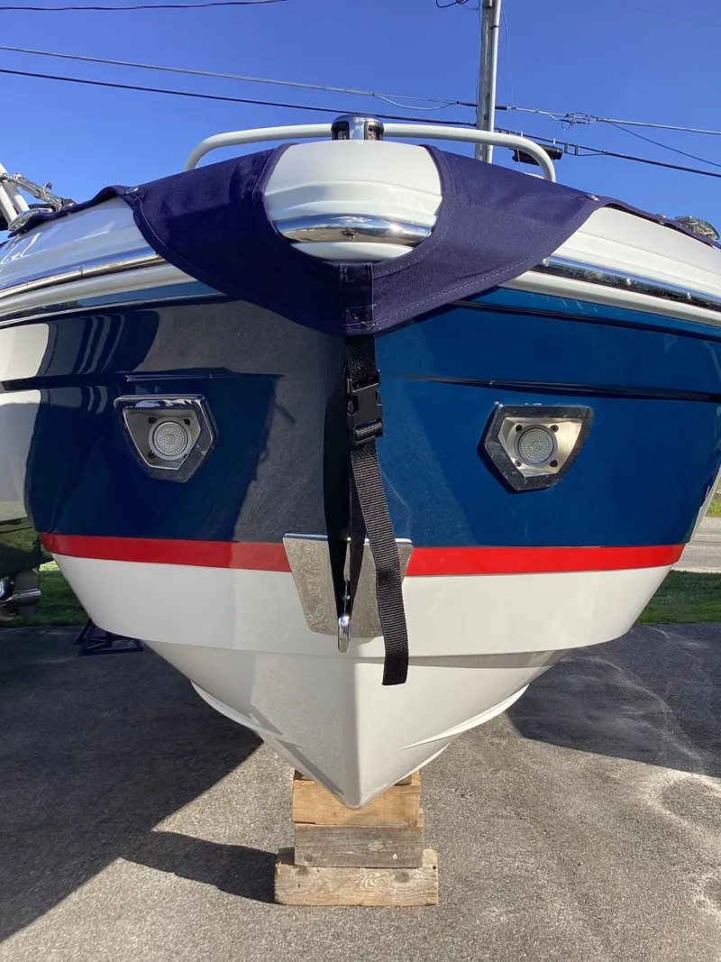 Slide: The Image of The 2027 Cobalt R26 is on a wooden block. It features a blue and white design with red accents. - 9