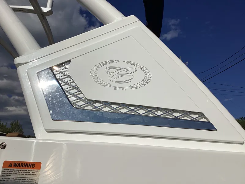 Slide: The Image of Close-up of a Cobalt R26 boat featuring a sleek emblem and modern design. - 6