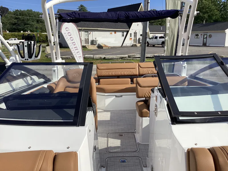 Slide: The Image of The image shows the cockpit of a Cobalt R26 boat with brown leather seats and glass windshields. - 19