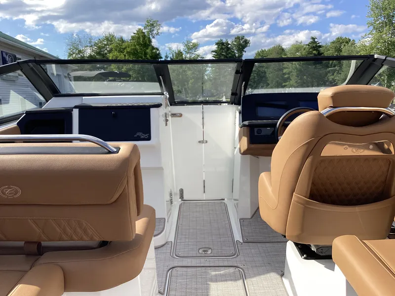 Slide: The Image of The image shows the cockpit of a Cobalt R26 boat with tan leather seats and a modern dashboard. - 17