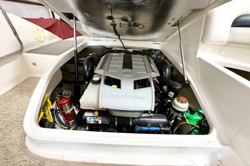 Slide: The Image of Engine compartment of 2008 Chaparral Sunesta 284 boat, featuring a MerCruiser engine. - 37