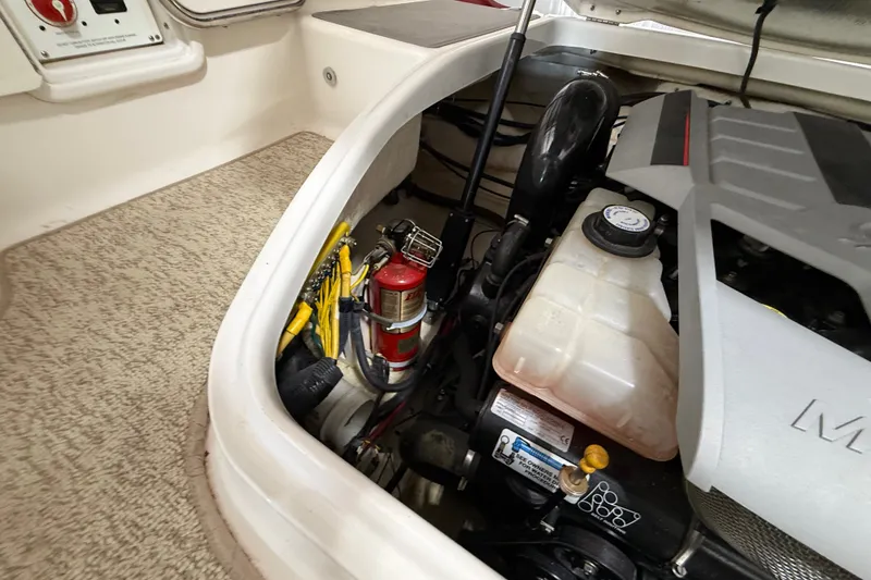 Slide: The Image of Engine compartment of 2008 Chaparral Sunesta 284 boat with fire extinguisher and fluid reservoir. - 38