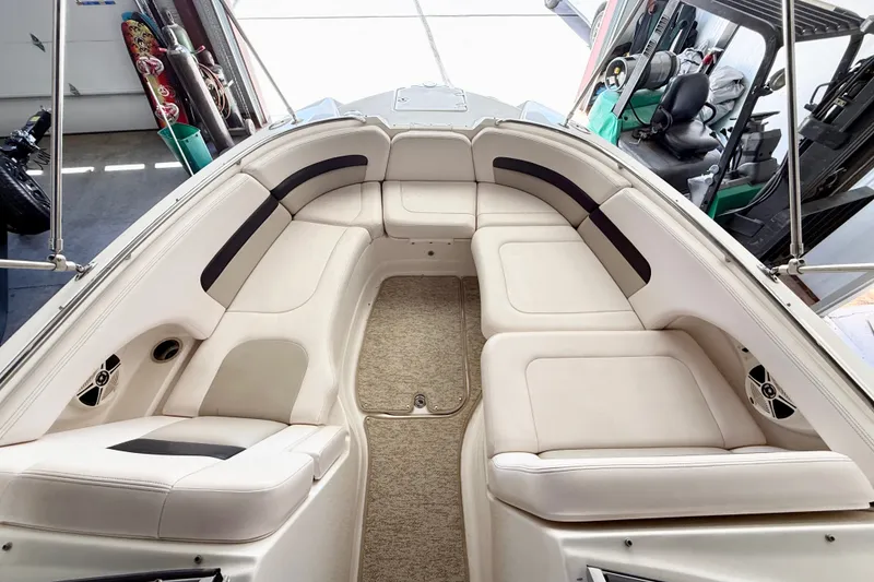 Slide: The Image of 2008 Chaparral Sunesta 284 boat interior with spacious seating and beige upholstery. - 32