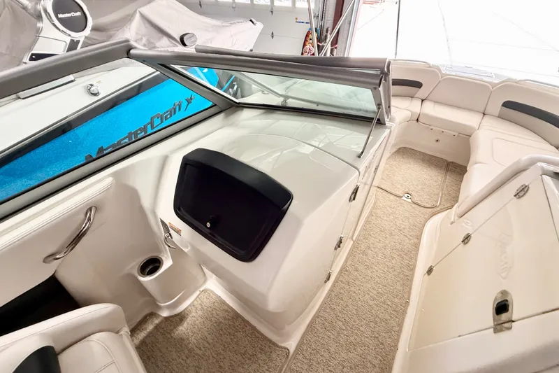 Slide: The Image of 2008 Chaparral Sunesta 284 boat interior with seating and storage compartments. - 20